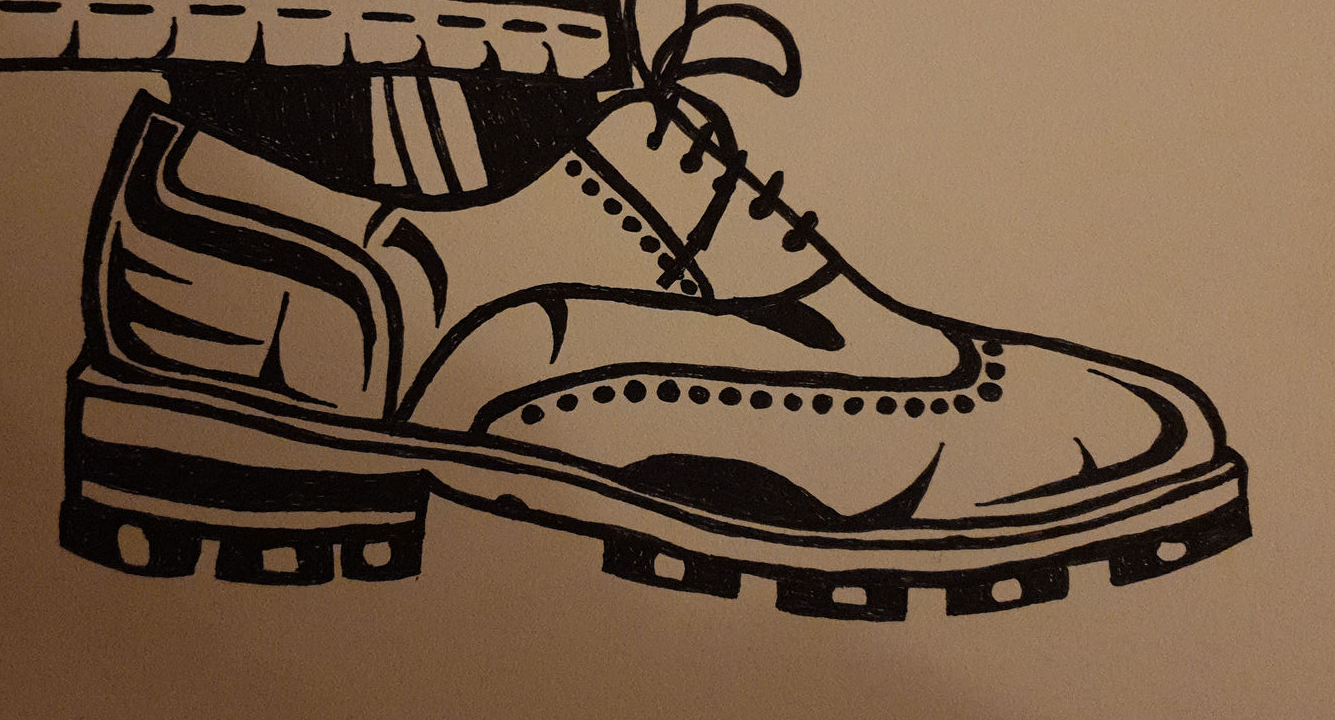 black and white drawing of a brogue show and the lower edge of trousers