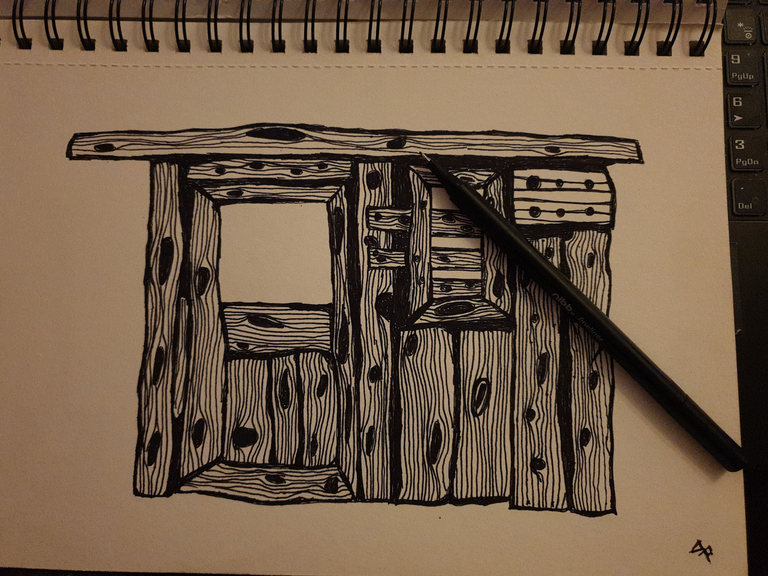 In drawing of an allotment shed with a pen lying atop the sketchpad